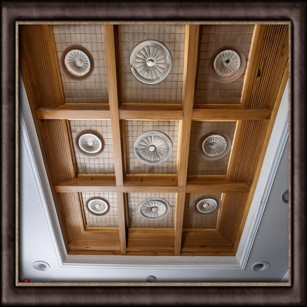 Information on dropped ceilings consisting of a secondary ceiling hung below the main one, commonly used to conceal ductwork and wiring, now also applied in residential designs.